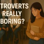 A quiet introverted girl holding a book in a café while others chat in the background, with bold text reading 'Introverts Really Boring?'